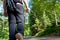 A photographer hiking in the forest