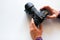 Photographer with his photo camera on a white background with space for text. World Photography Day