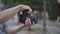 Photographer Holding A Modern Camera Outdoor On Bokeh Background. Closeup