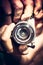 Photographer holding photo camera lens taking photo grunge street style. Photography lifestyle concept