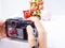 The photographer is intending to use digital camera take pictures of the Christmas decoration, Have a nice holiday on this