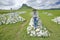 Photographer Joe Sohm at Sandlwana hill or Sphinx with soldiers graves in foreground, the scene of the Anglo Zulu battle site of