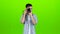 Photographer makes beautiful pictures of different famous models. Green screen. Slow motion