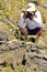 A photographer and an marine Iguana