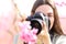 Photographer photographing flowers with macro lens and dslr