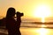 Photographer photographing sun with dslr