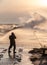 Photographer photographing waves at Alberta Pier