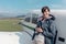 Photographer posing with a light aircraft