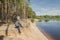 Photographer relaxes in nature near the river