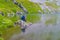 Photographer on a rock on a lake