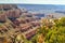 A Photographer Sets Up For a Picture on a Flat Edge at the Grand Canyon of Arizona