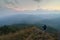 Photographer shooting the beautiful landscape of the Thailand evening mountains.