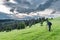 Photographer shoots a mountain landscape in the evening