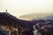 Photographer silhouette on a scottish mountain in a cloudy day