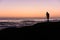 Photographer silhouette on seashore