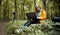 Photographer sitting stump using laptop