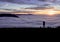 Photographer standing above fog on hill