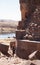 Photographer standing near the tower of Sillustani, Lake Umayo,