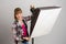 Photographer studio sets correct direction of light softbox