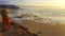 Photographer at sunset on Costa Vicentina, Portugal. Praia do Amado