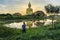 Photographer take a photo with big buddha in wat muang background at Ang Thong Province popular buddhist shrine in Thailand