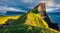 Photographer takes picture of Kallur Lighthouse, Kalsoy island. Incredible summer scene ofFaroe Islands, Denmark, Europe. Majestic