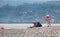 Photographer taking a macro picture at seaside