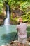 Photographer taking photo of Chamouze waterfall. Mauritius