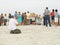 Photographer taking photos of group on beach