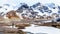 Photographer taking a picture of the Athabasca Glacier with Mount Andromeda, Mount Athabasca, Hilda Peak in the Columbia Icefields