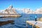 Photographer taking picture of Fantastic panorama of  Reinefjorden on Toppoya island with Olstinden peak