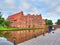 Photographer taking picture of Group Beautiful historic houses on river bank