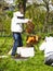 Photographer taking pictures of apiarist in garden