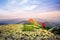 Photographer taking pictures on a hill mountaintop