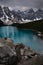 Photographer taking pictures of Moraine lake in Banff National Park.