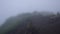 Photographer on top of a volcano in the dense clouds, volkano Batur