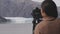 Photographer tourist in Alaska taking photos of glacier national park