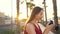 Photographer tourist woman taking photos with camera in a beautiful tropical landscape at sunset