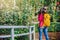 Photographer travel photograph in the rose garden. Travel relax. Multicolored roses beautiful, background blur