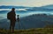 Photographer, Tripod Camera and Morning Panorama of the Carpathian Mountains