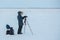 A photographer and a videographer removing the report on the Lena River in Yakutia, Sakha Republic