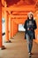 Photographer walking in corridor in kasuga taisha