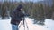 Photographer in winer mountain