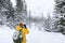 The photographer in winter forest