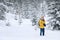 The photographer in winter forest