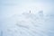 Photographer in winter trekking on the snowy mountains