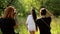 Photographers doing a photo session for girls in nature.