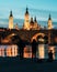 Photographers in front of Basilica del Pilar and Puente de Piedra at sunset in Zaragoza, Aragon, Spain