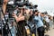 Photographers and journalists at a press conference.