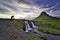 Photographers are photographing at kirkjufell waterfall, mountains and waterfalls in the evening